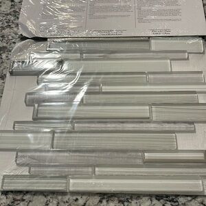 New in packaging interior Wall Tile.  Nominal dimensions 11” x 11” x 5/16”